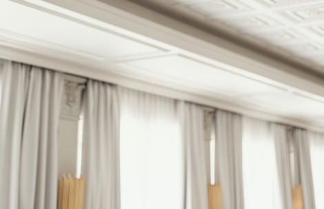 a blurry image of a room with white curtains