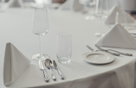 a table with a white tablecloth and silverware