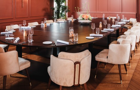 a table with empty glasses and plates
