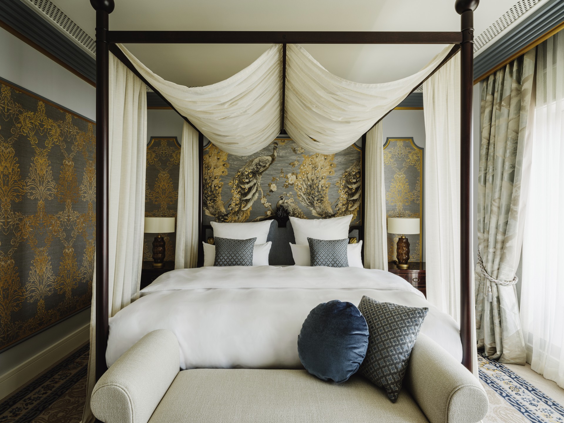 a bed with a canopy bed and a couch