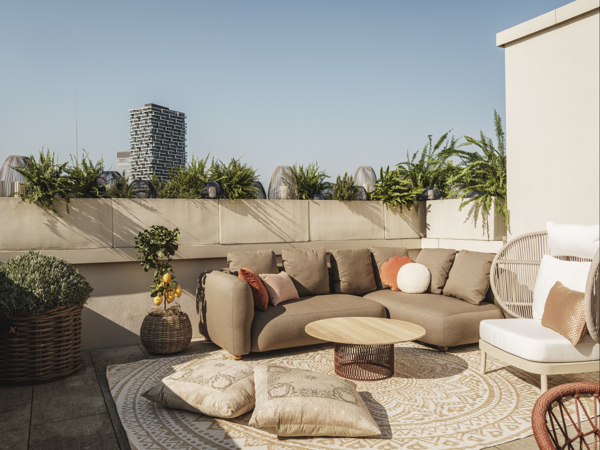 a patio with a couch and pillows