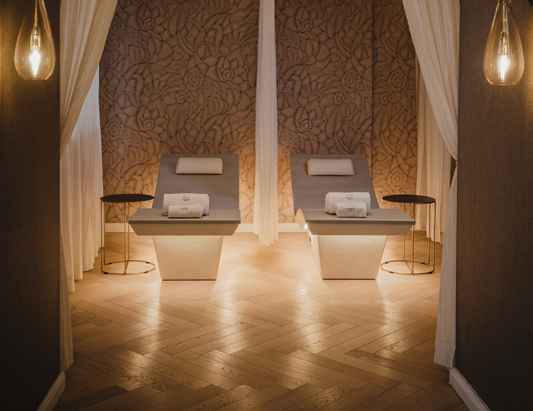 a room with white curtains and tables
