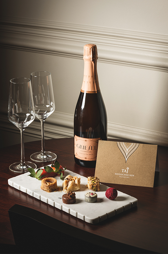 a bottle of champagne and two wine glasses