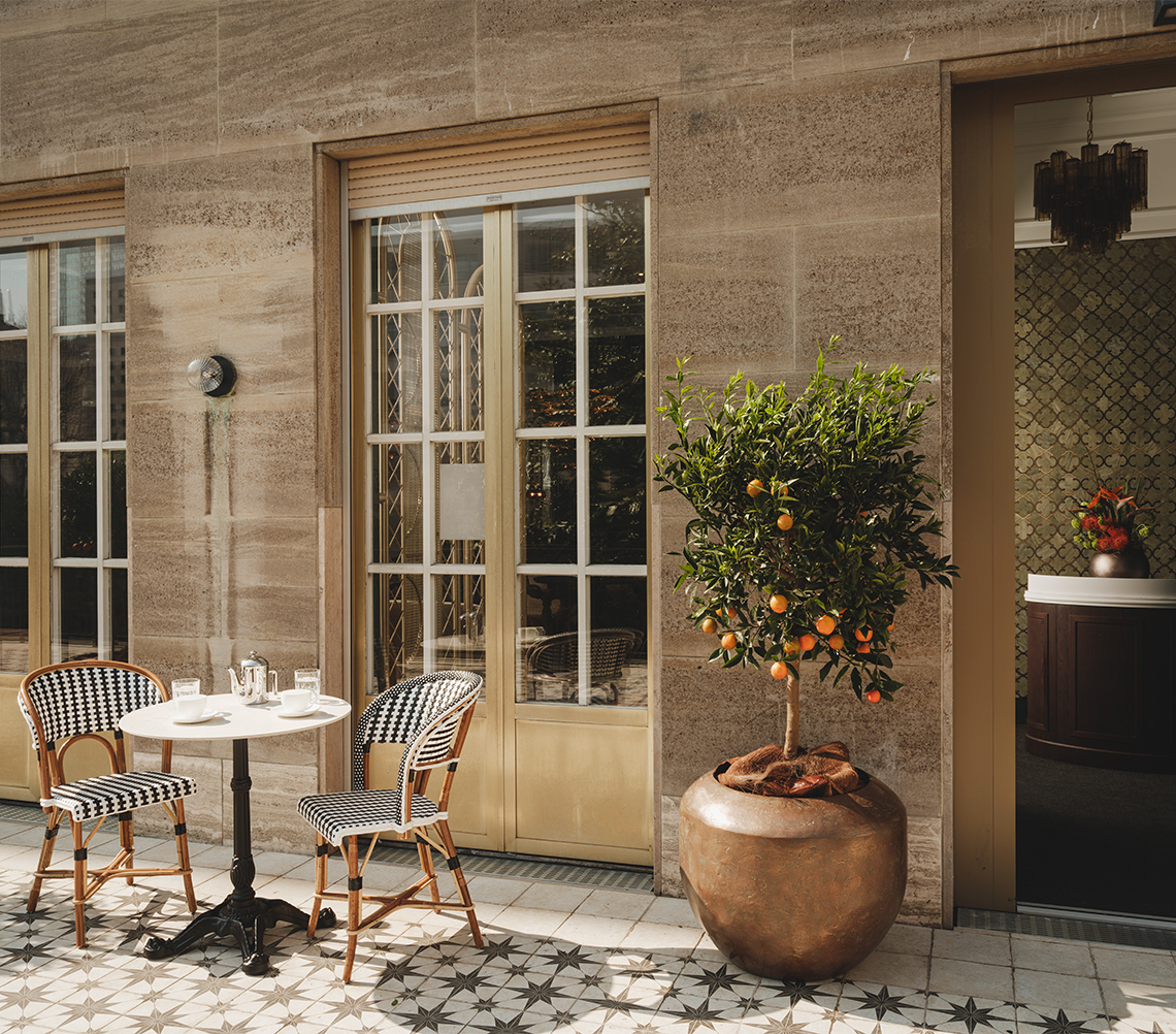 a table and chairs outside of a building
