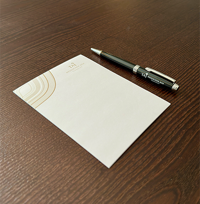a pen and a notepad on a table