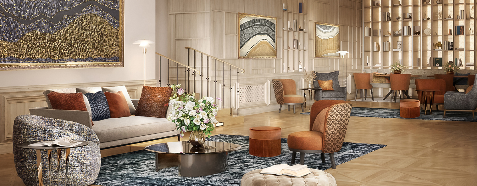a room with a staircase and a couch and a vase of flowers