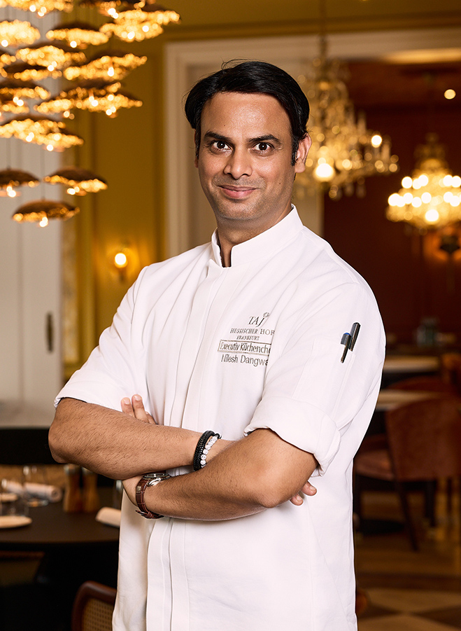 a man in a white chef coat