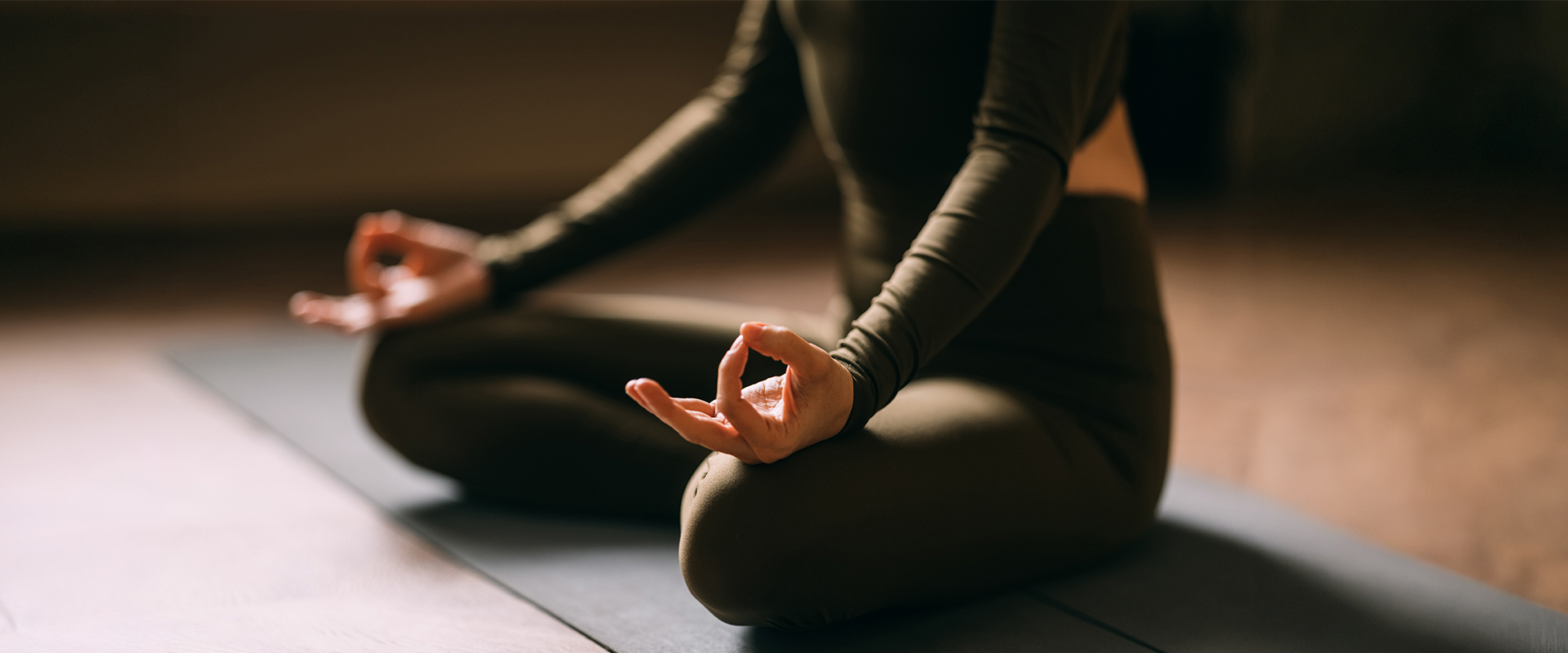 a person sitting in a yoga pose