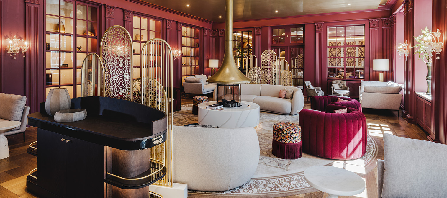 a room with red walls and a fireplace