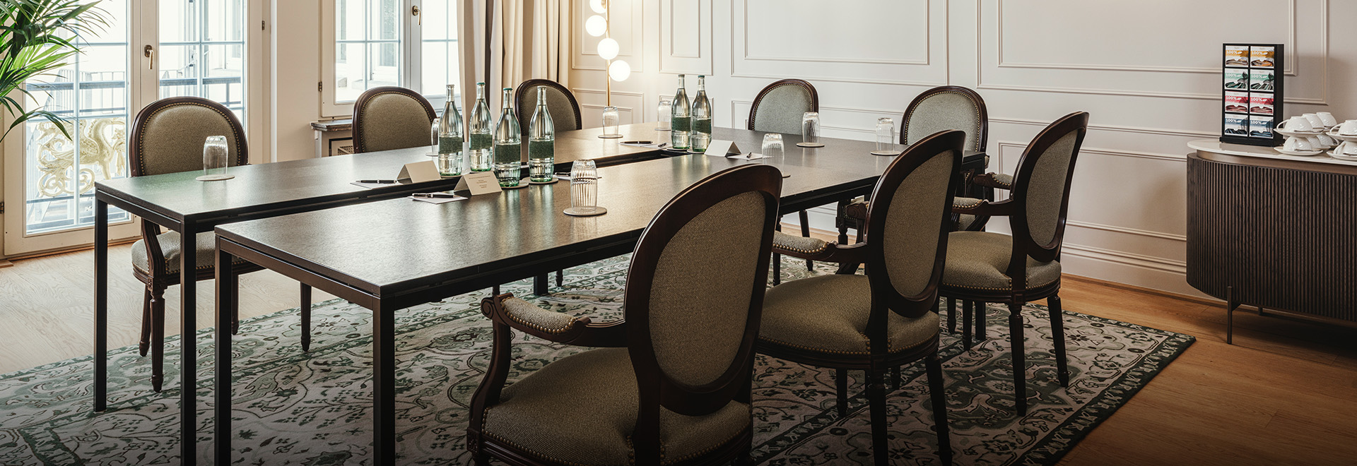a table with empty bottles and chairs