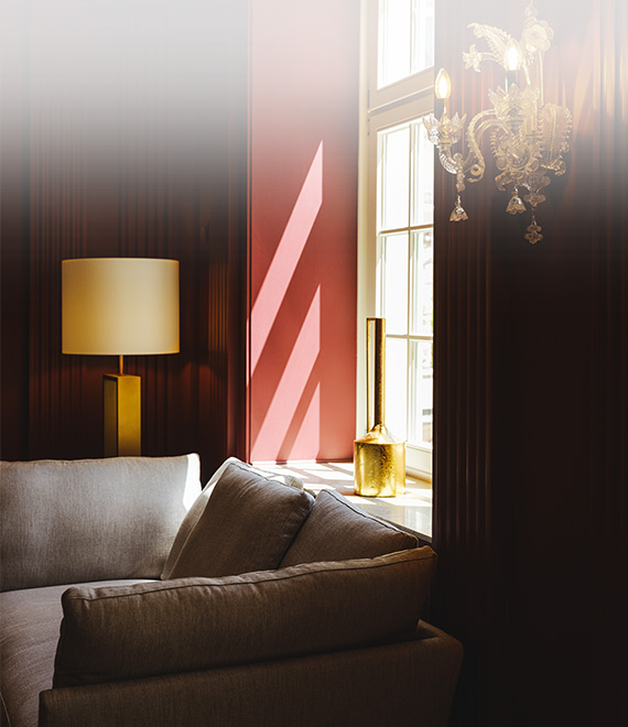 a couch and lamp in a room