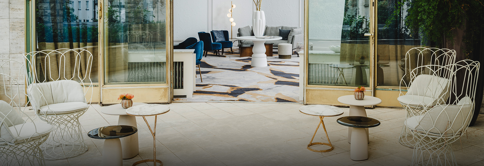 a room with a white table and blue chairs