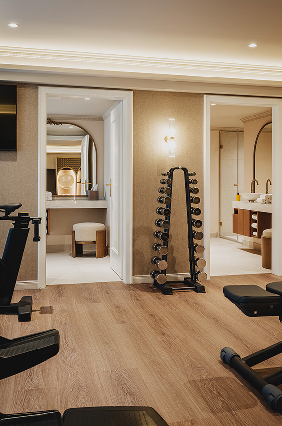 a room with exercise equipment and a mirror