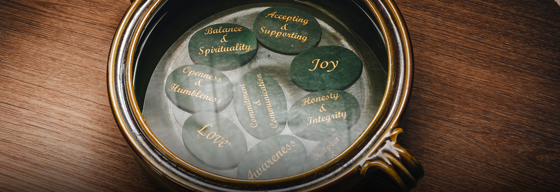 a circular black stones with writing on them
