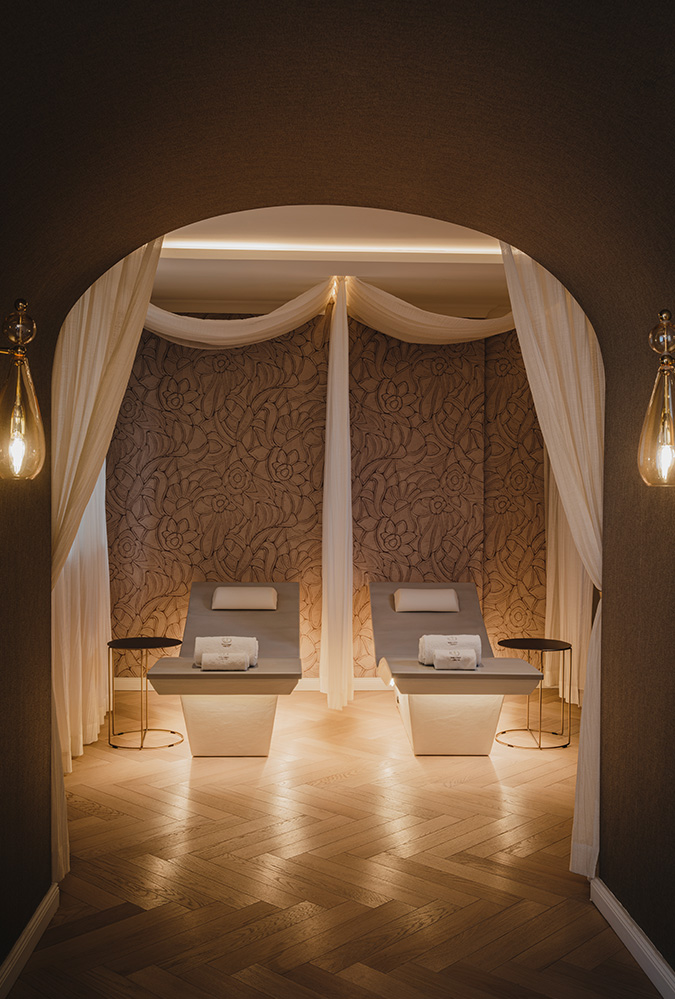 a room with white curtains and tables