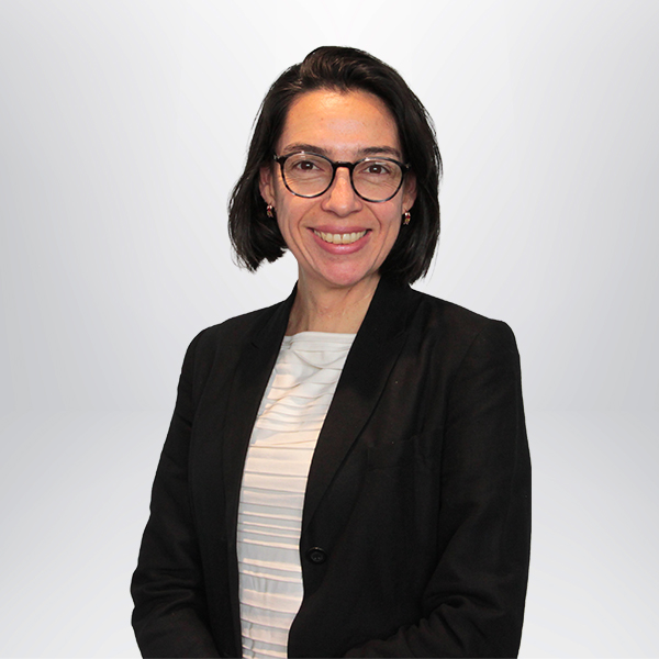 a woman wearing glasses and a black jacket