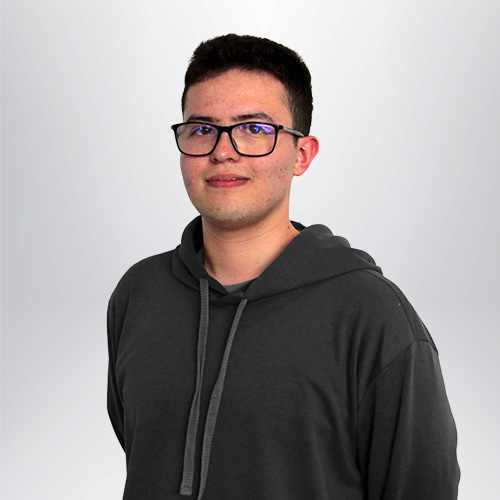 a man wearing glasses and a sweatshirt