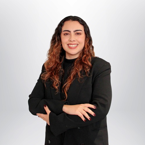 a woman with long hair wearing a black jacket