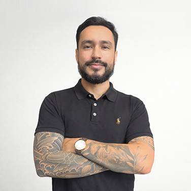 a man with tattoos on his arms