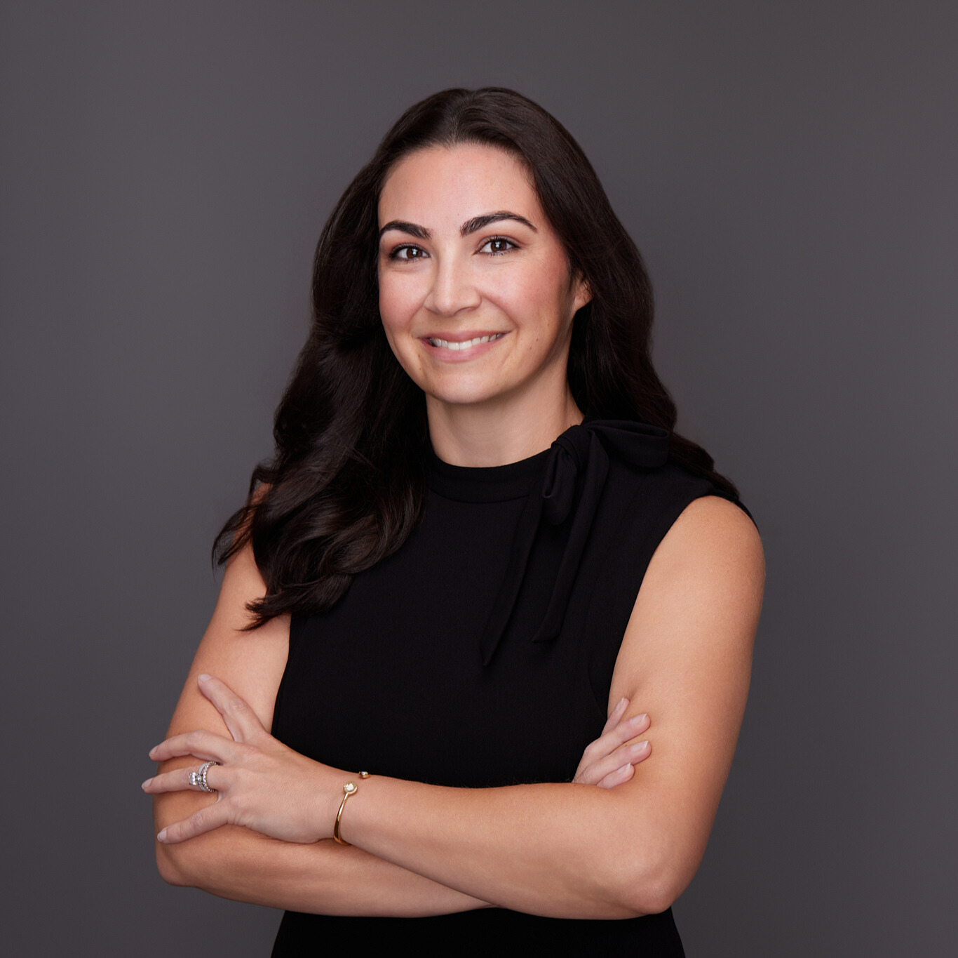 a woman with her arms crossed