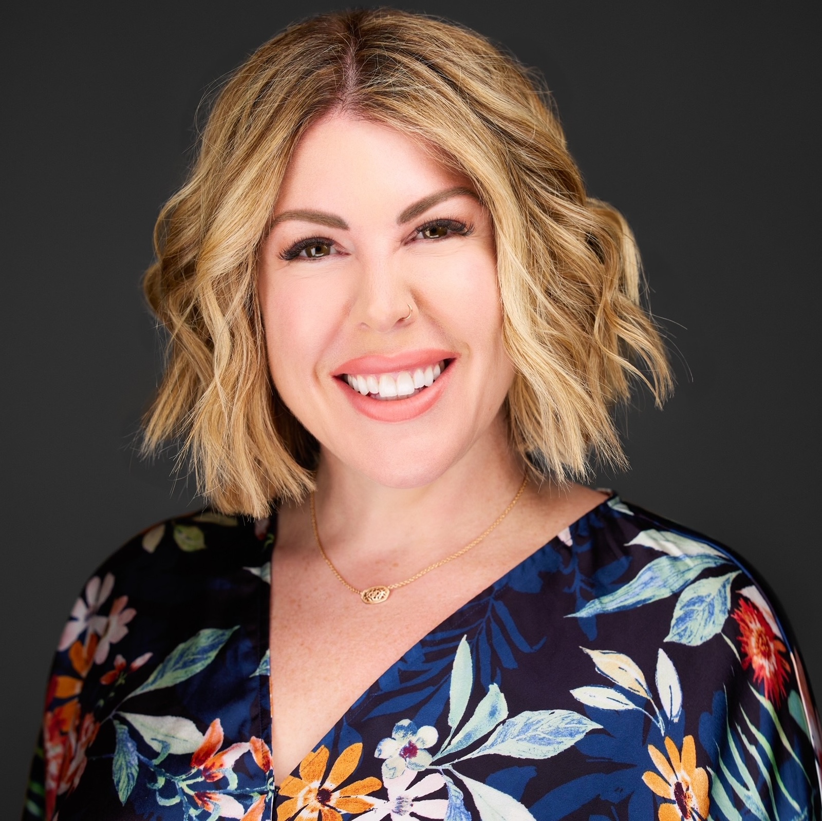 a woman smiling at camera