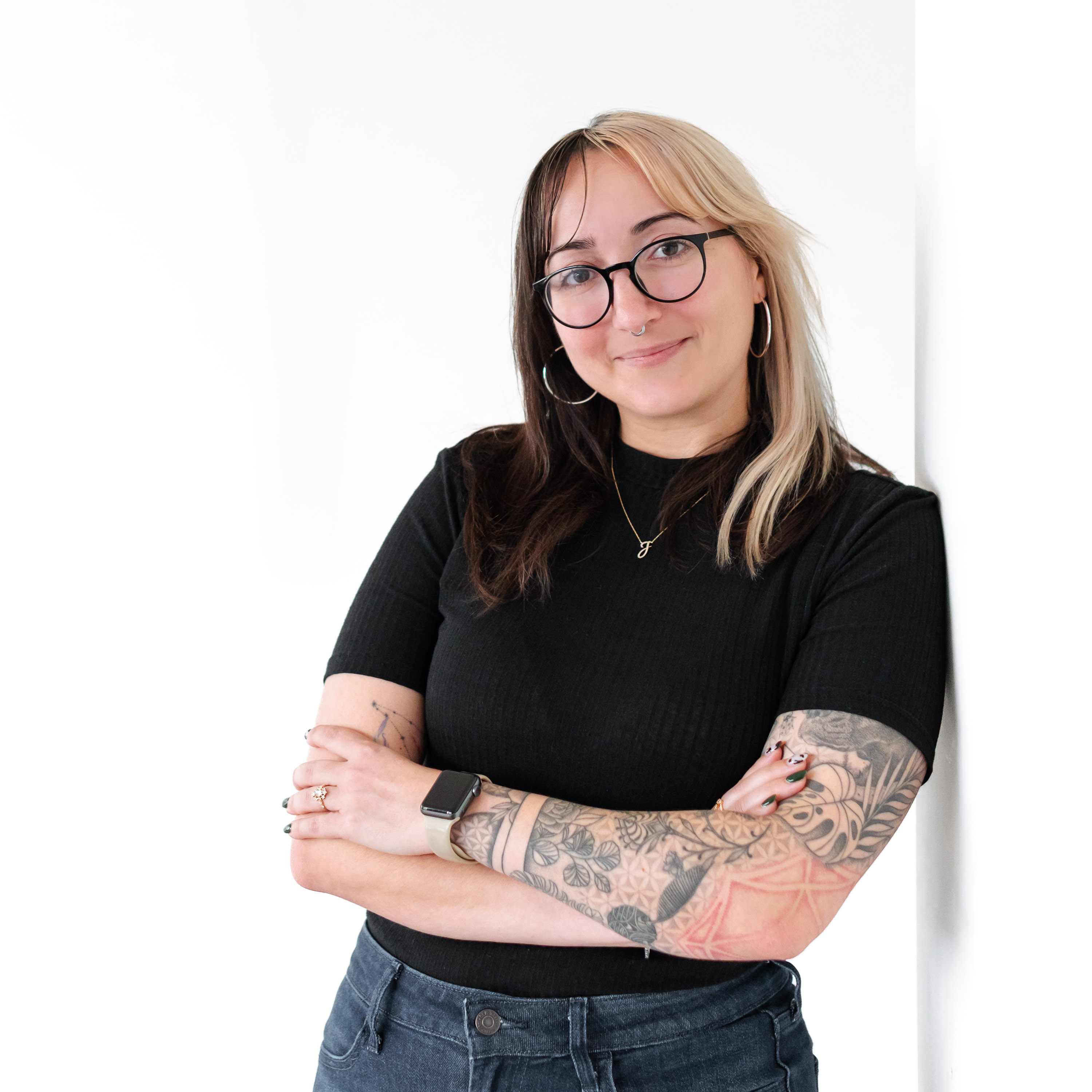 a woman with tattoos on her arms