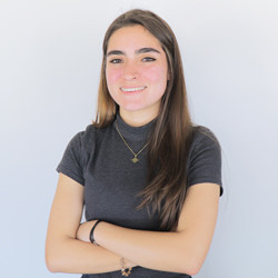 a woman with her arms crossed