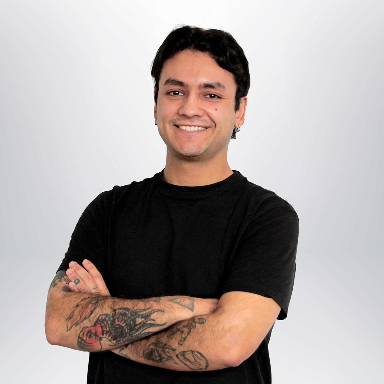 a man with tattoos on his arms