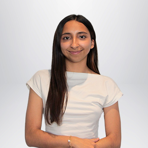 a woman with long hair wearing a white shirt