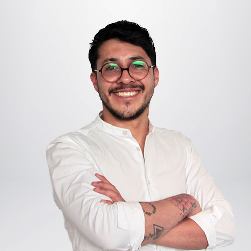 a man with glasses and a beard wearing a white shirt