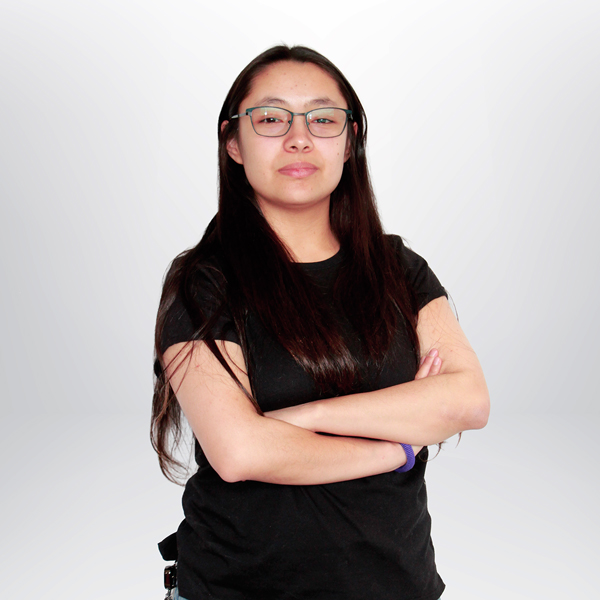 a woman with glasses and black shirt with her arms crossed