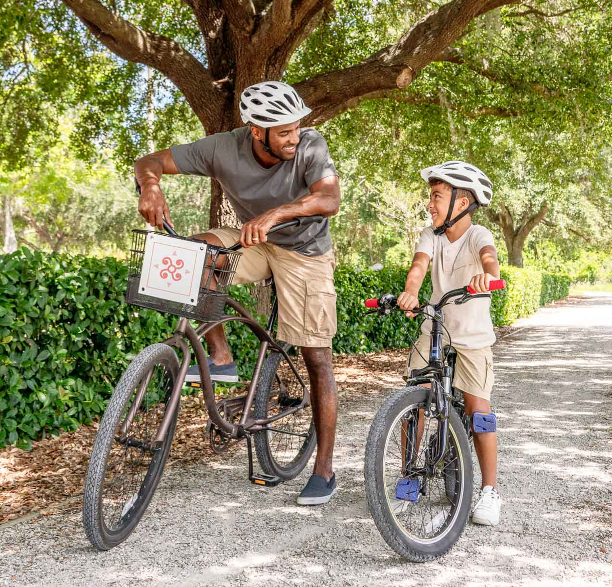 a man and child on a bicycle