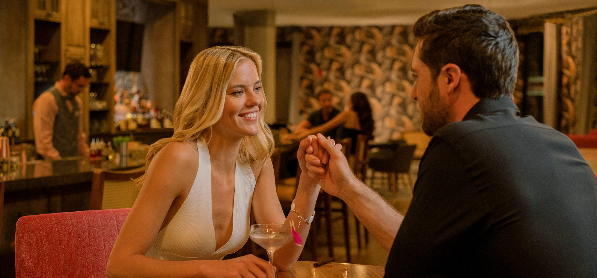 a man and woman holding hands