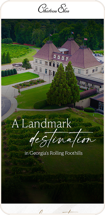 a building with trees and grass