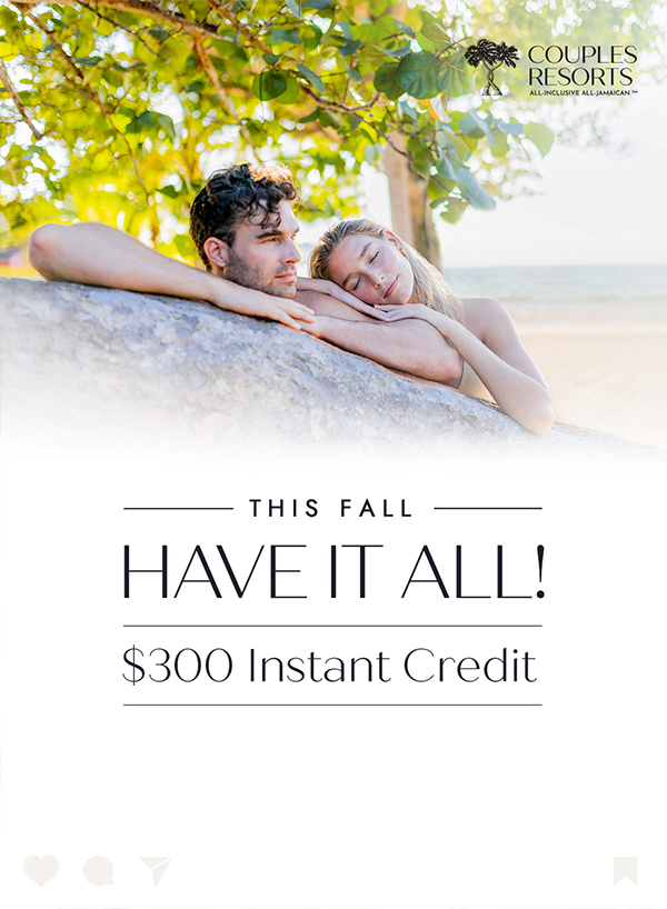 a man and woman leaning on a rock