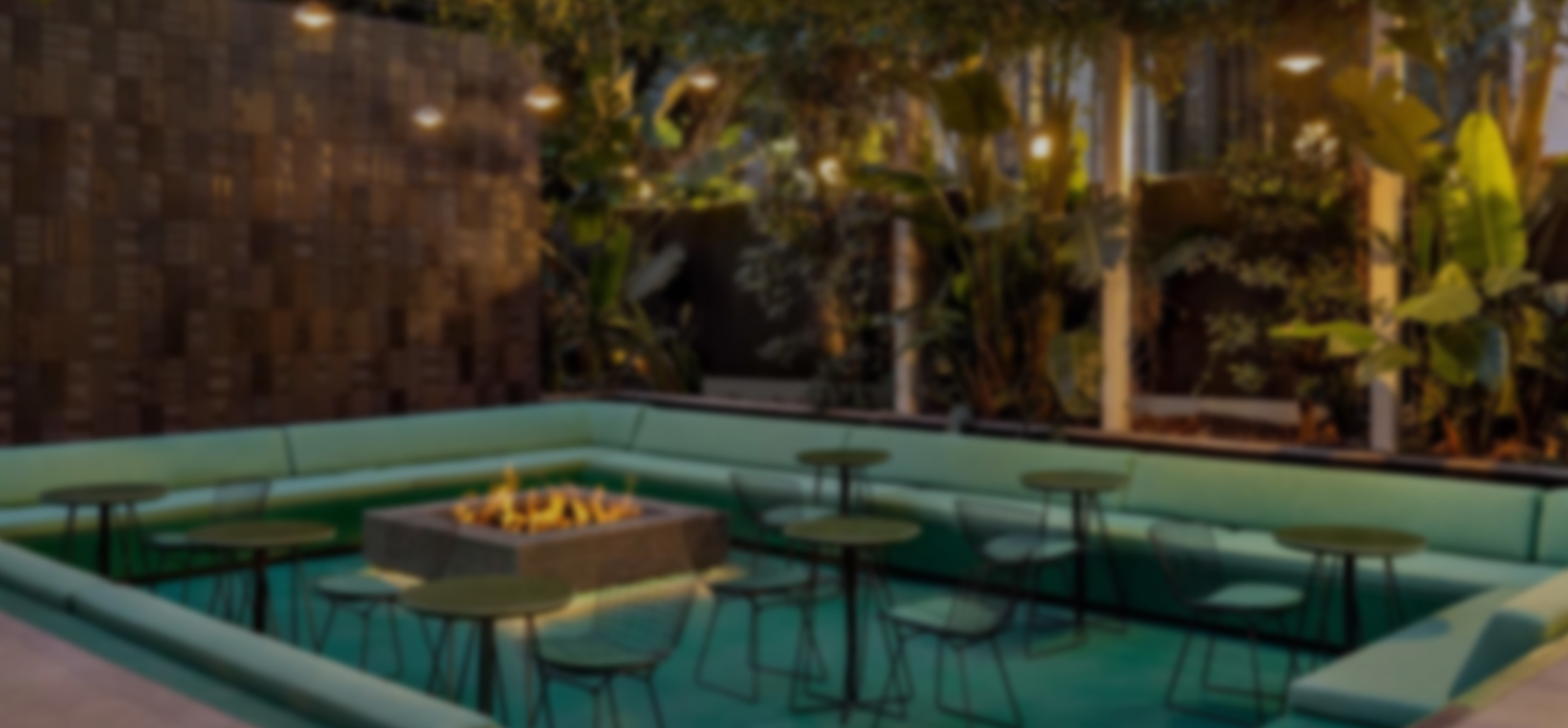 a blurry image of a patio with a fire pit