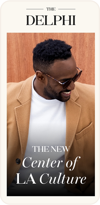 a man wearing sunglasses and a coat