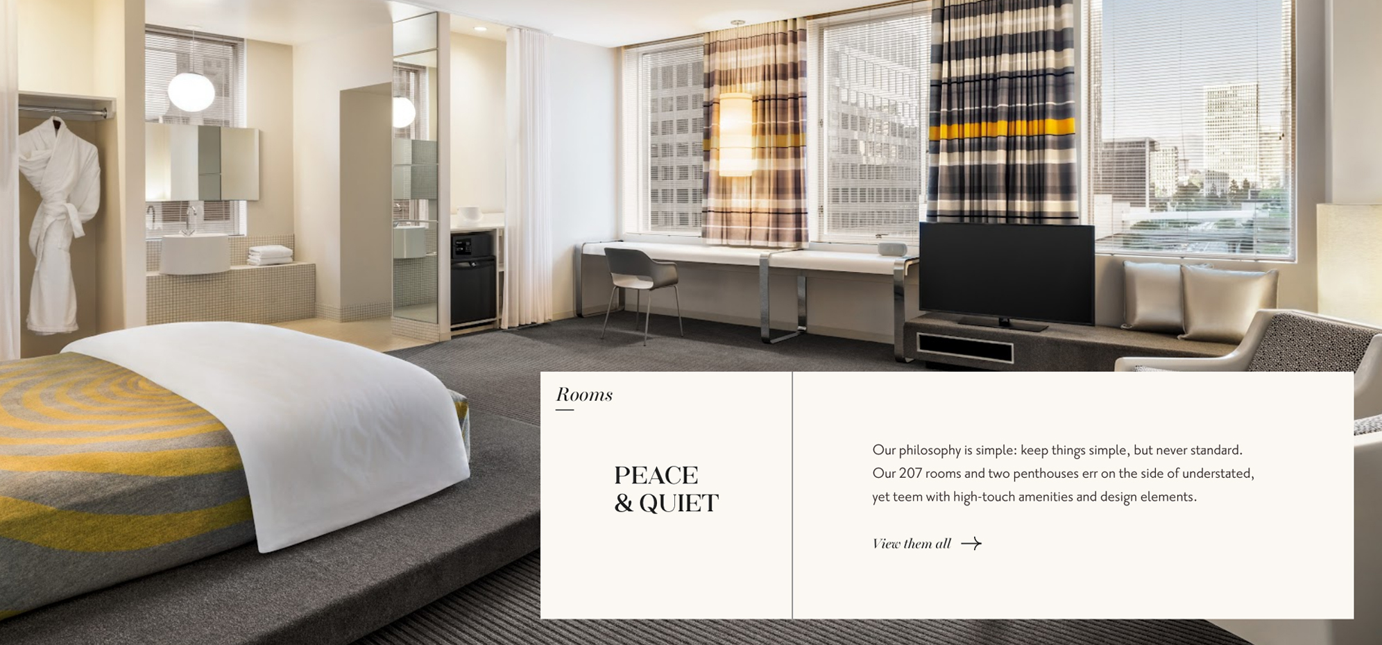 a room with a bed and a television