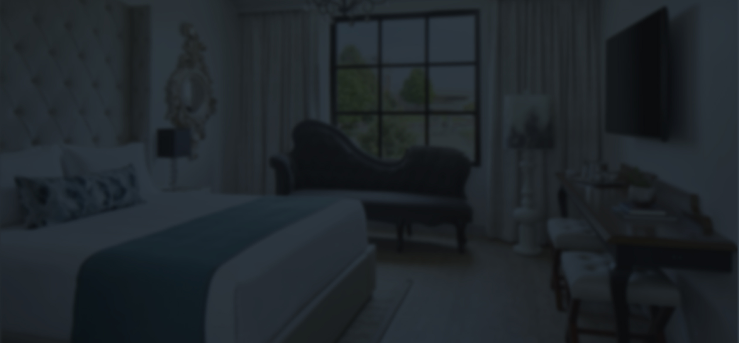 a bedroom with a couch and a bed