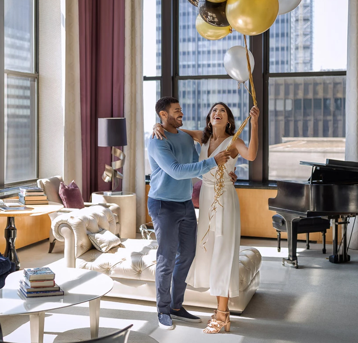 a man and woman holding balloons