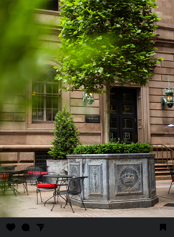 a building with a fountain and tables