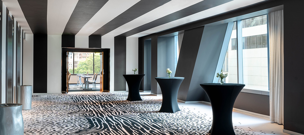 a room with black and white striped walls