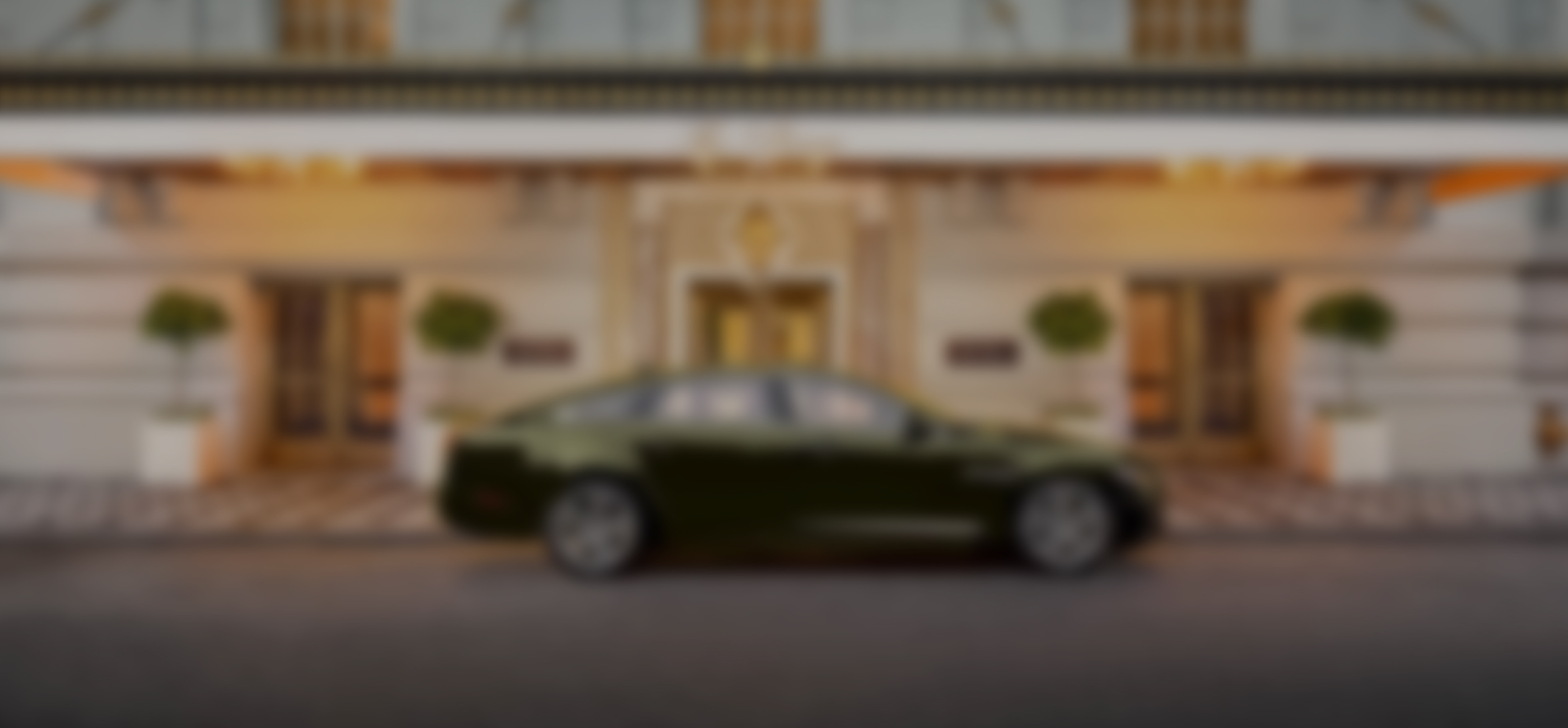 a blurry image of a car parked in front of a building