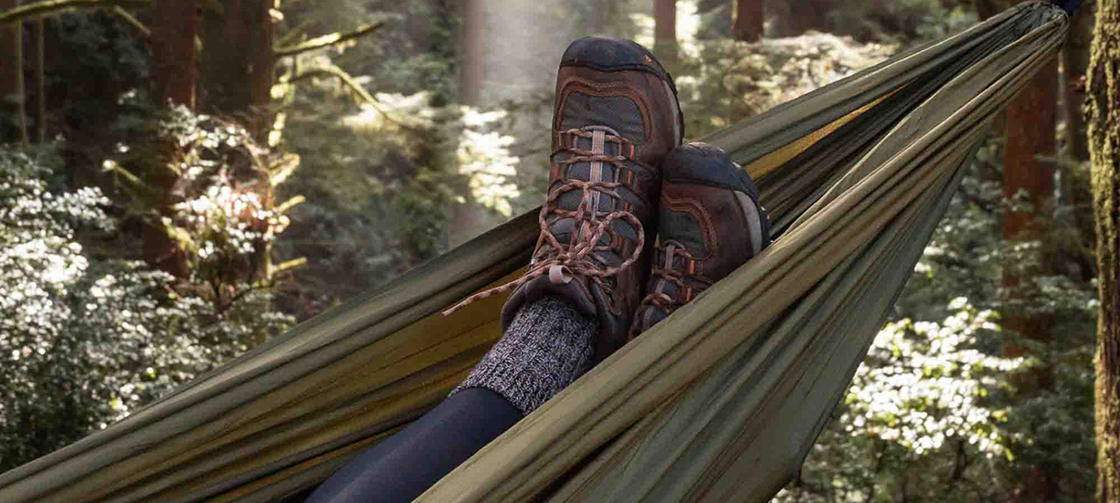 a person's feet in a hammock