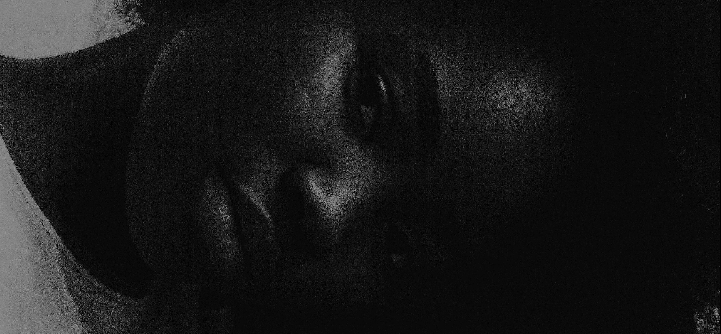 a black and white photo of a person's face