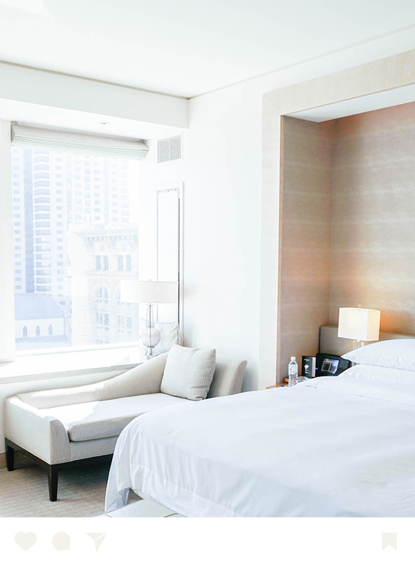 a bedroom with a bed and a chair