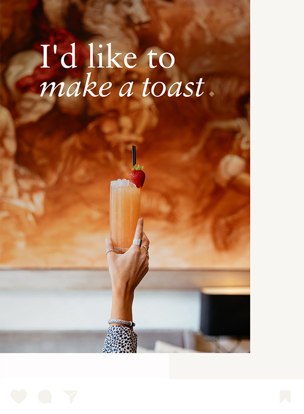 a hand holding a glass of juice