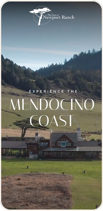 a house in a valley with trees and hills