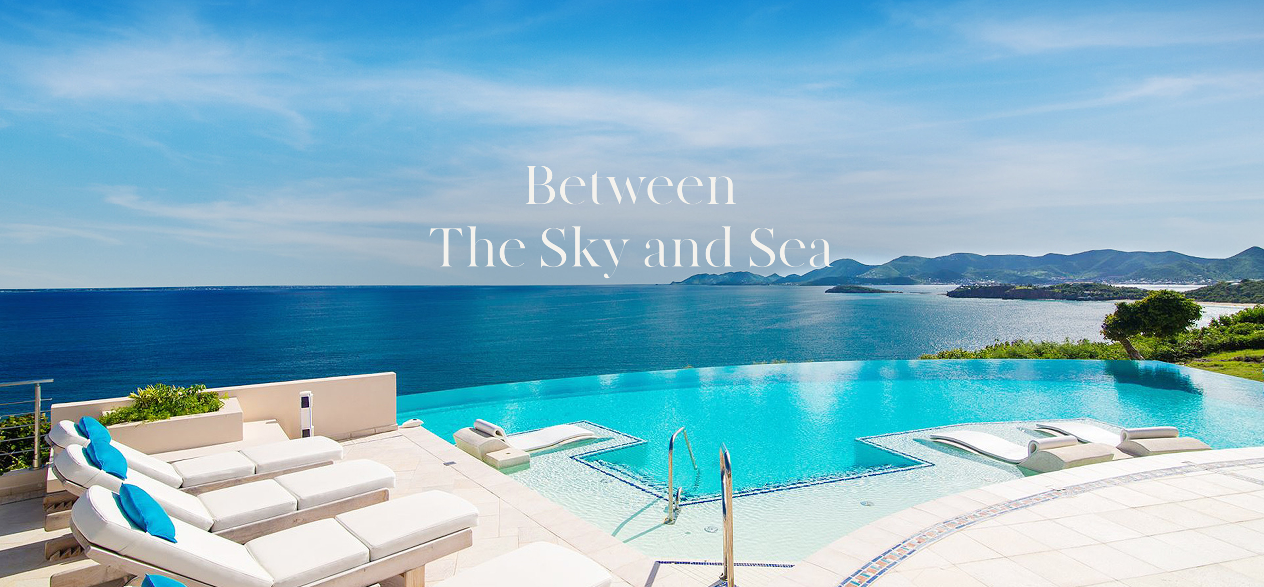 a pool with chairs and a large body of water