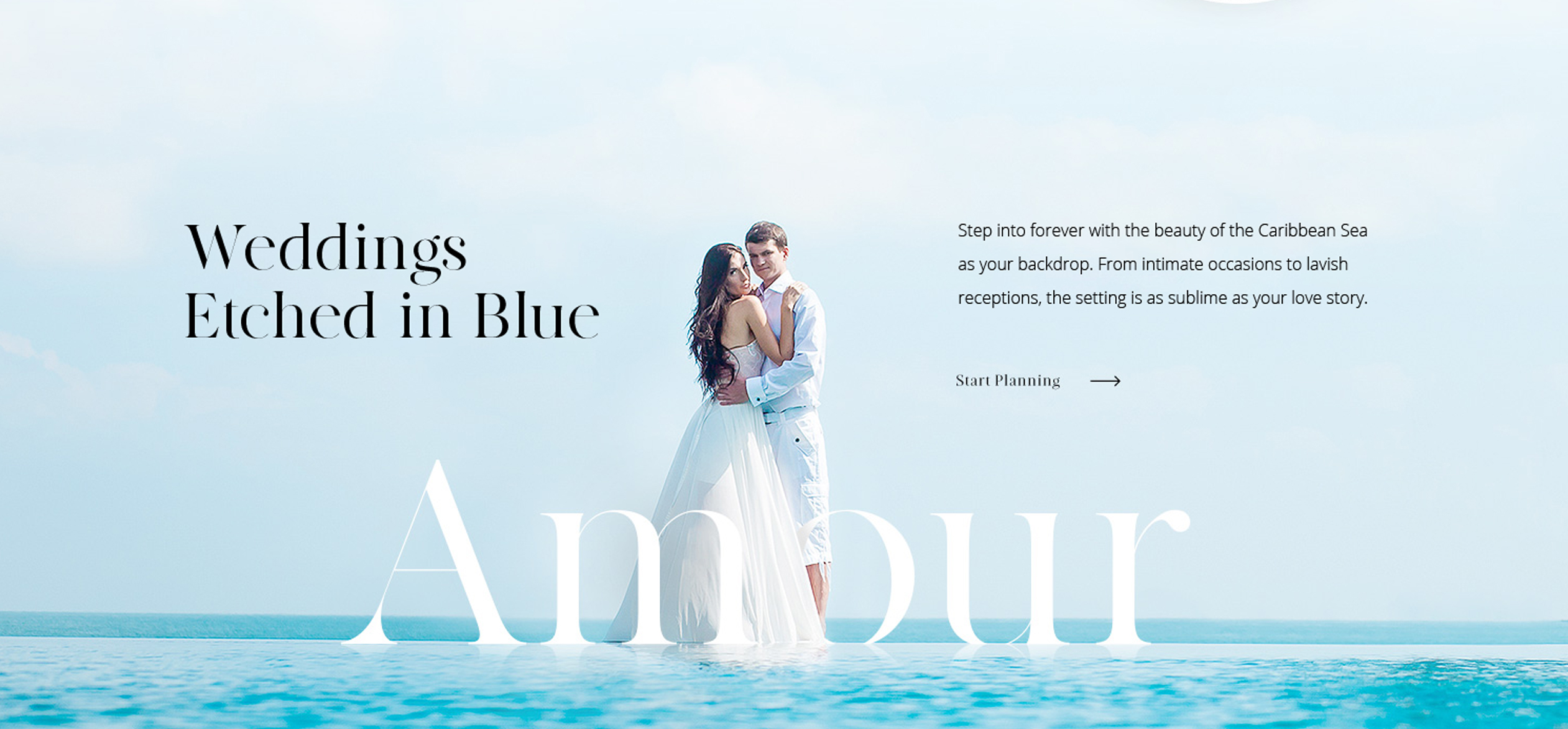 a man and woman in white dress standing in water
